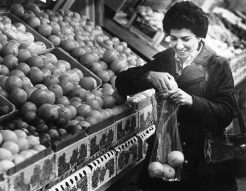 Woman picking out fruit